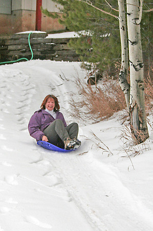 Rox sledding in the driveway
